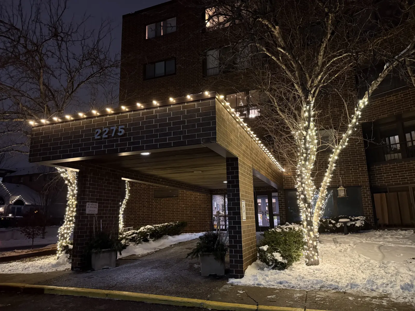 Commercial holiday lighting at an apartment entrance